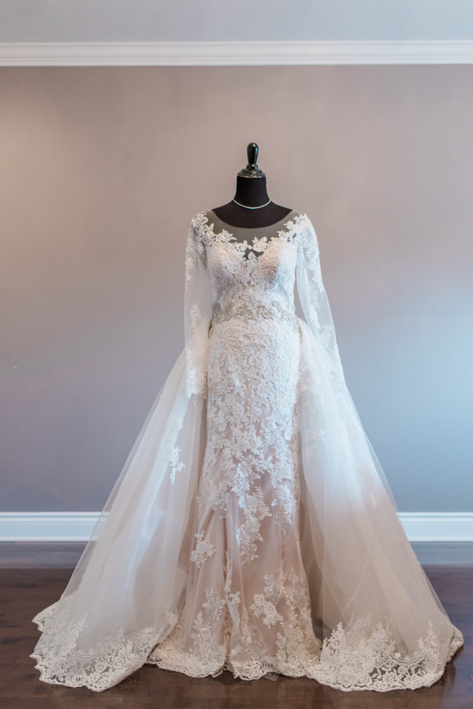 pronovias wedding gown on dress mannequin - long sleeve lace wedding gown