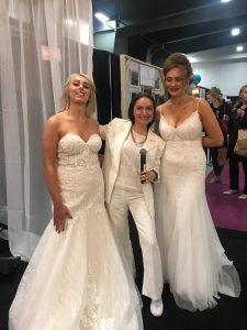 Camila with two bridal models in white gowns